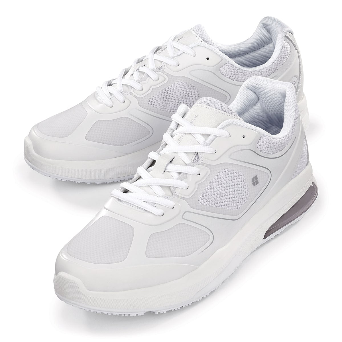 The Evolution II White from Shoes For Crews are slip-resistant and water-resistant trainers, pair seen from the left side, emphasised on the tip of the left shoe.