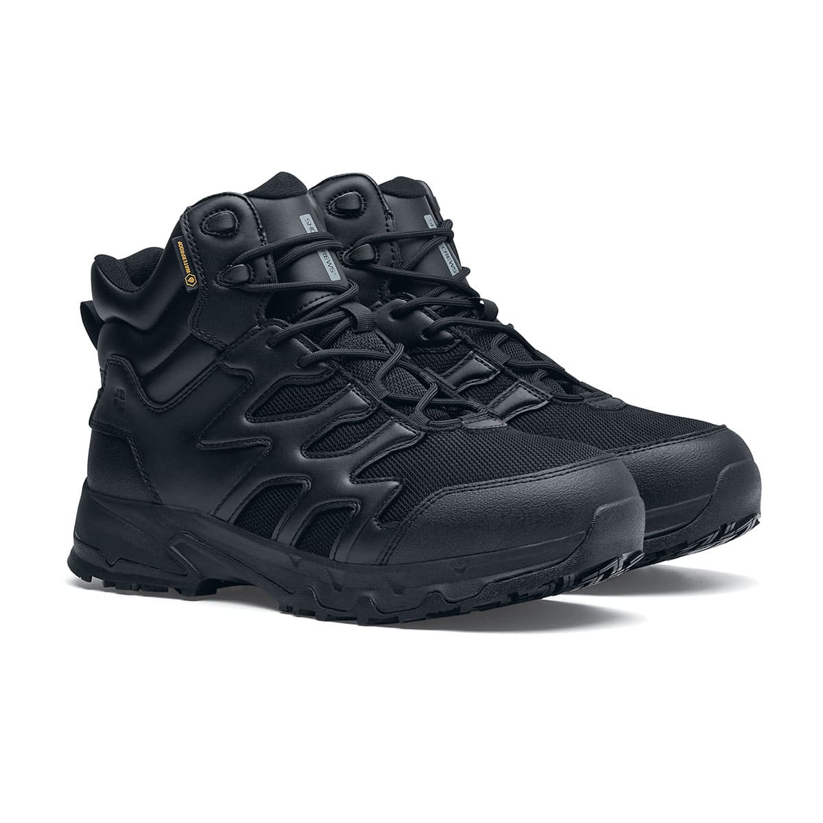 The Shoes for Crews Carrig Mid is a slip-resistant safety boot with a waterproof upper, pair seen in profile on the right.