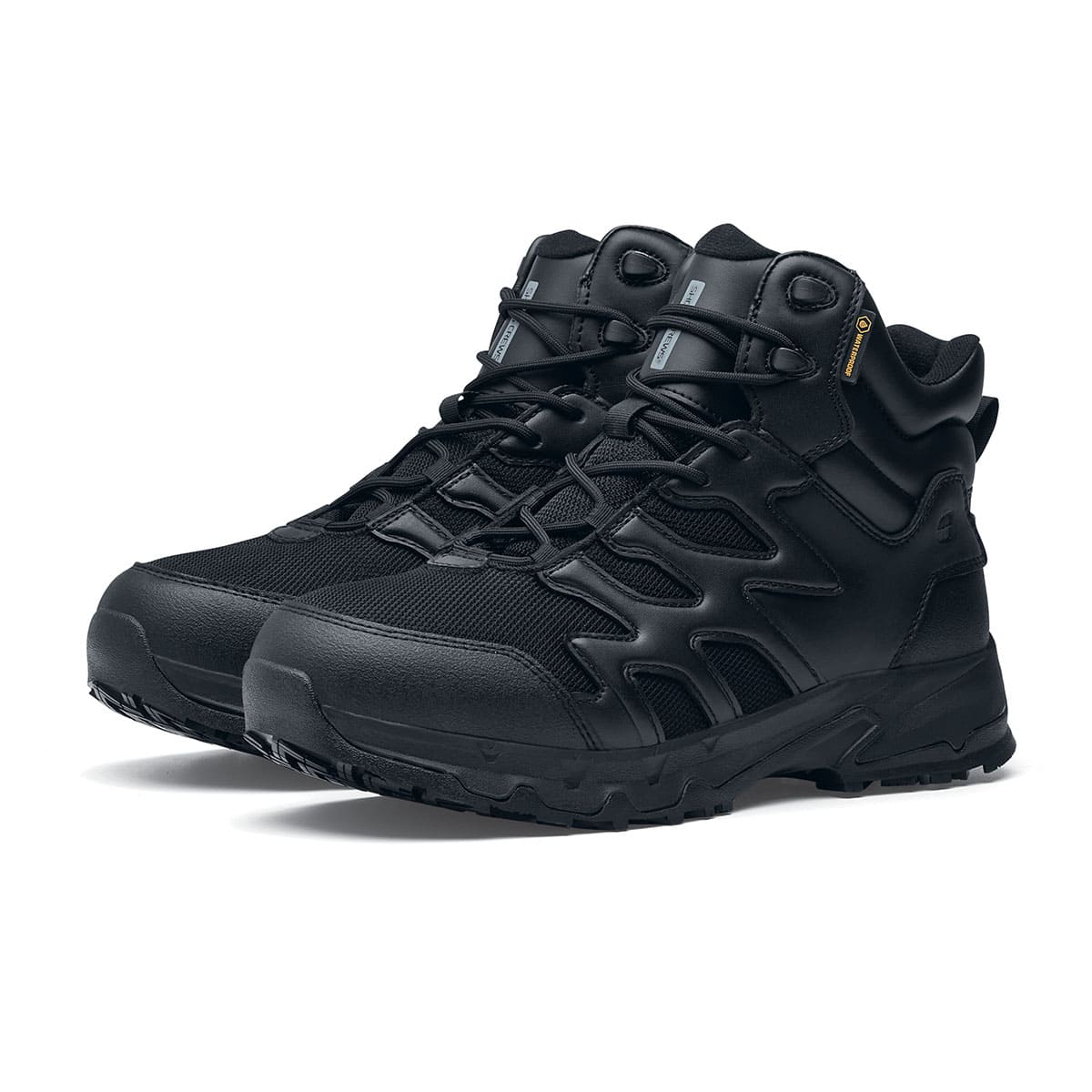 The Shoes for Crews Carrig Mid is a slip-resistant safety boot with a waterproof upper, pair seen in profile on the left.