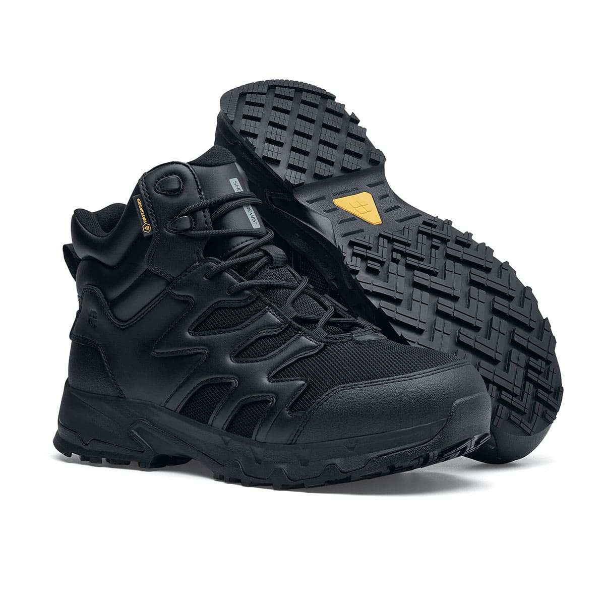 The Shoes for Crews Carrig Mid is a slip-resistant safety boot with a waterproof upper, pair seen on the right side and on the sole.