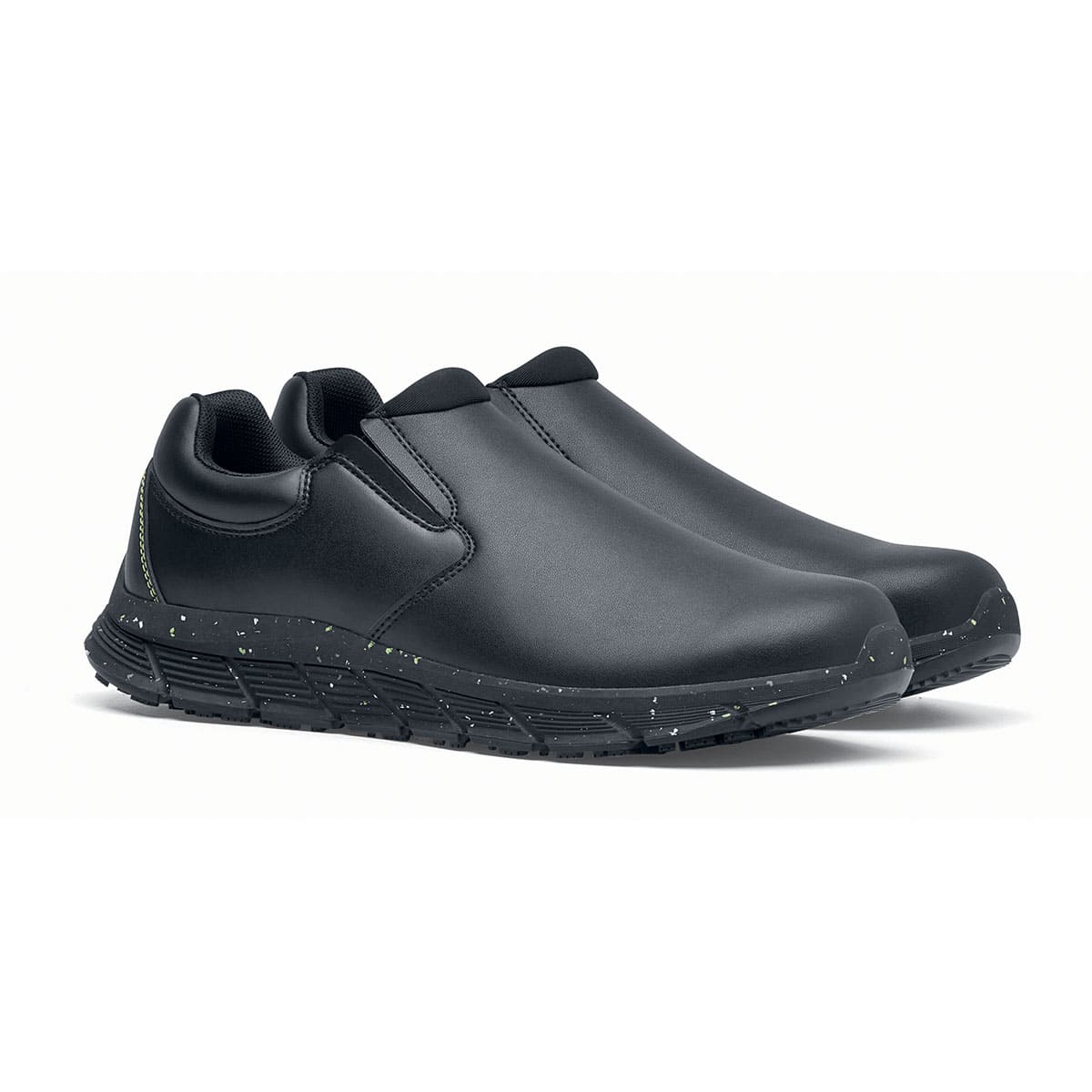 The Shoes for Crews Cater Eco Women's Black is a sustainable, slip-resistant safety shoe, pair seen in profile on the right.