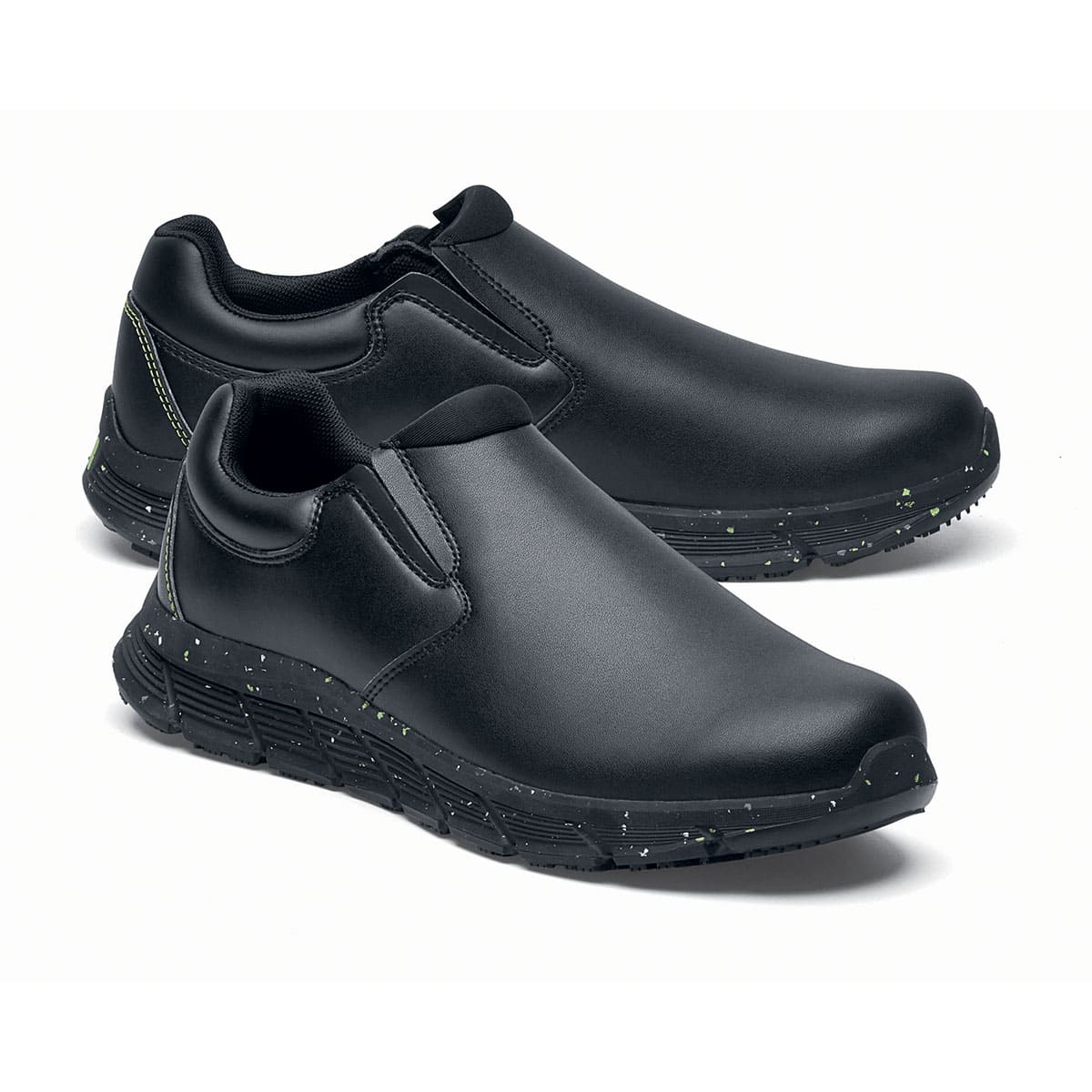 The Shoes for Crews Cater Eco Women's Black is a sustainable, slip-resistant safety shoe, pair seen from the right side, emphasised on the tip of the right shoe.