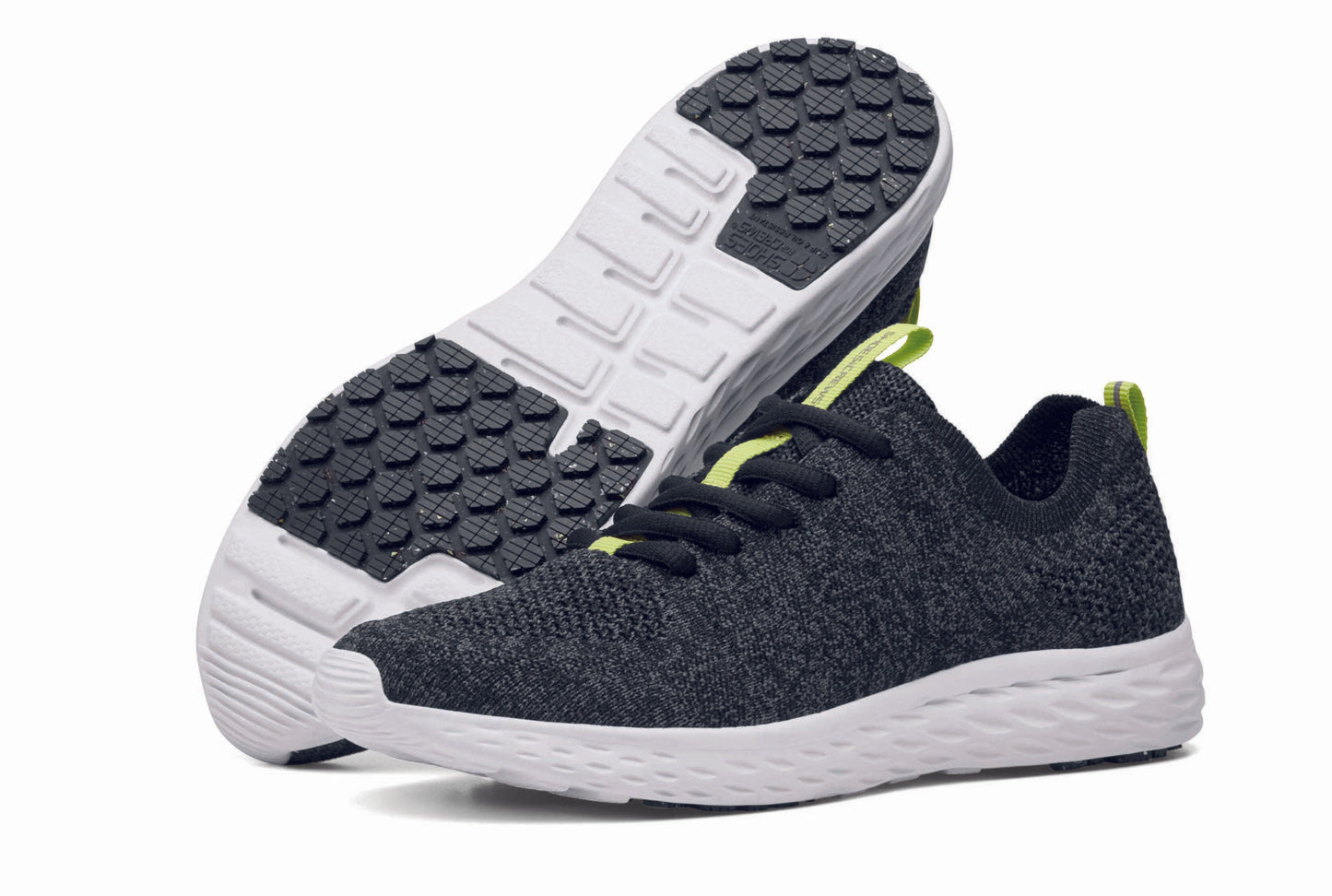 The Everlight™ ECO Womens Black/Grey from Shoes For Crews are lightweight, breathable slip-resistant trainers made from recycled materials, pair seen from the left side and the sole.