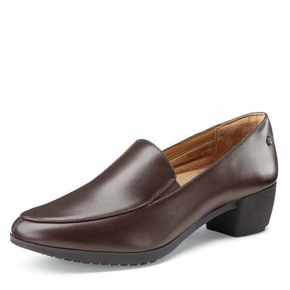 The Envy III Brown from Shoes For Crews is a slip-resistant shoe made with a durable, water-resistant leather upper, seen from the left profile.