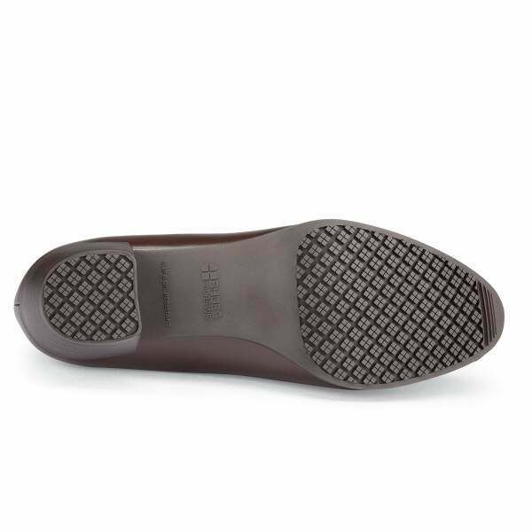 The Envy III Brown from Shoes For Crews is a slip-resistant shoe made with a durable, water-resistant leather upper, seen from below.