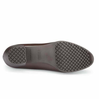 The Envy III Brown from Shoes For Crews is a slip-resistant shoe made with a durable, water-resistant leather upper, seen from below.