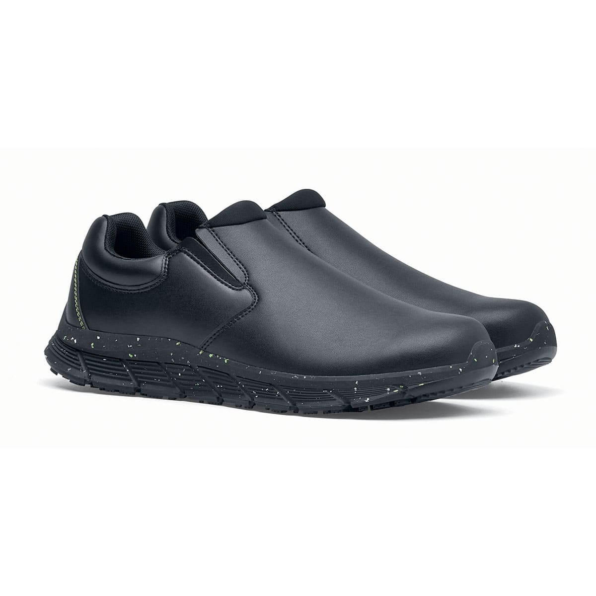 The Shoes for Crews Cater Eco Men's Black is a sustainable, slip-resistant safety shoe, pair seen in profile on the right.