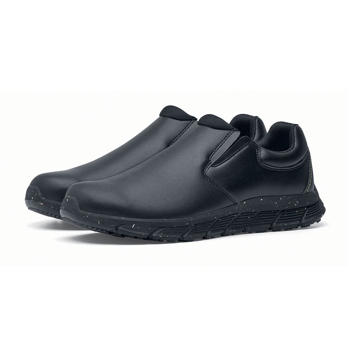 The Shoes for Crews Cater Eco Men's Black is a sustainable, slip-resistant safety shoe, pair seen in profile on the left.
