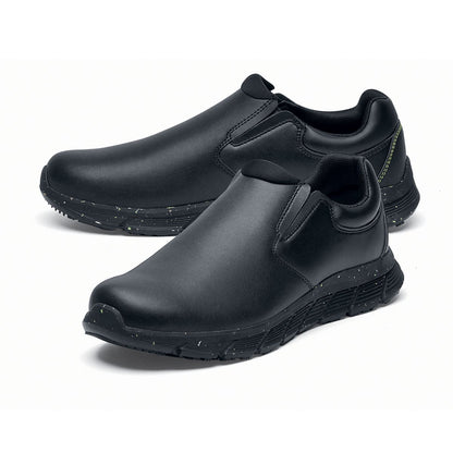 The Shoes for Crews Cater Eco Men's Black is a sustainable, slip-resistant safety shoe, pair seen from the left  side, emphasised on the tip of the left shoe.