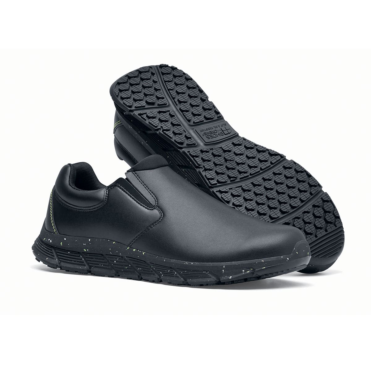 The Shoes for Crews Cater Eco Men's Black is a sustainable, slip-resistant safety shoe, pair seen from the right side and sole.
