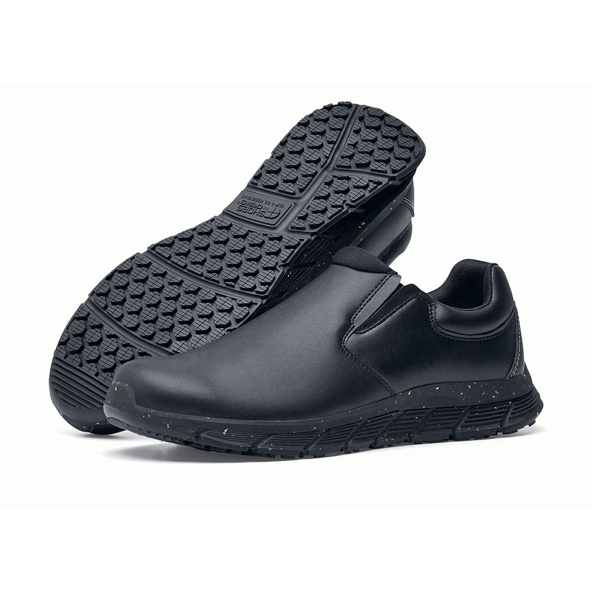 The Shoes for Crews Cater Eco Men's Black is a sustainable, slip-resistant safety shoe, pair seen from the left side and sole.