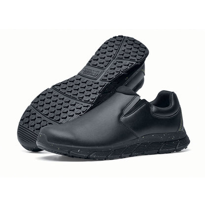 The Shoes for Crews Cater Eco Women's  Black is a sustainable, slip-resistant safety shoe, pair seen from the left  side and sole.