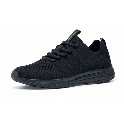 The Everlight™ Everlight Eco Women's Black from Shoes For Crews are lightweight and breathable slip-resistant trainers made from recycled materials, seen from the left profile.