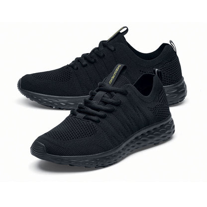 The Everlight™ Everlight Eco Women's Black from Shoes For Crews are lightweight and breathable slip-resistant trainers made from recycled materials, pair seen from the left side, emphasised on the tip of the left  shoe.