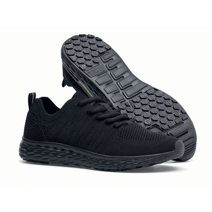 The Everlight™ Everlight Eco Women's Black from Shoes For Crews are lightweight and breathable slip-resistant trainers made from recycled materials,pair seen from the right side and the sole.