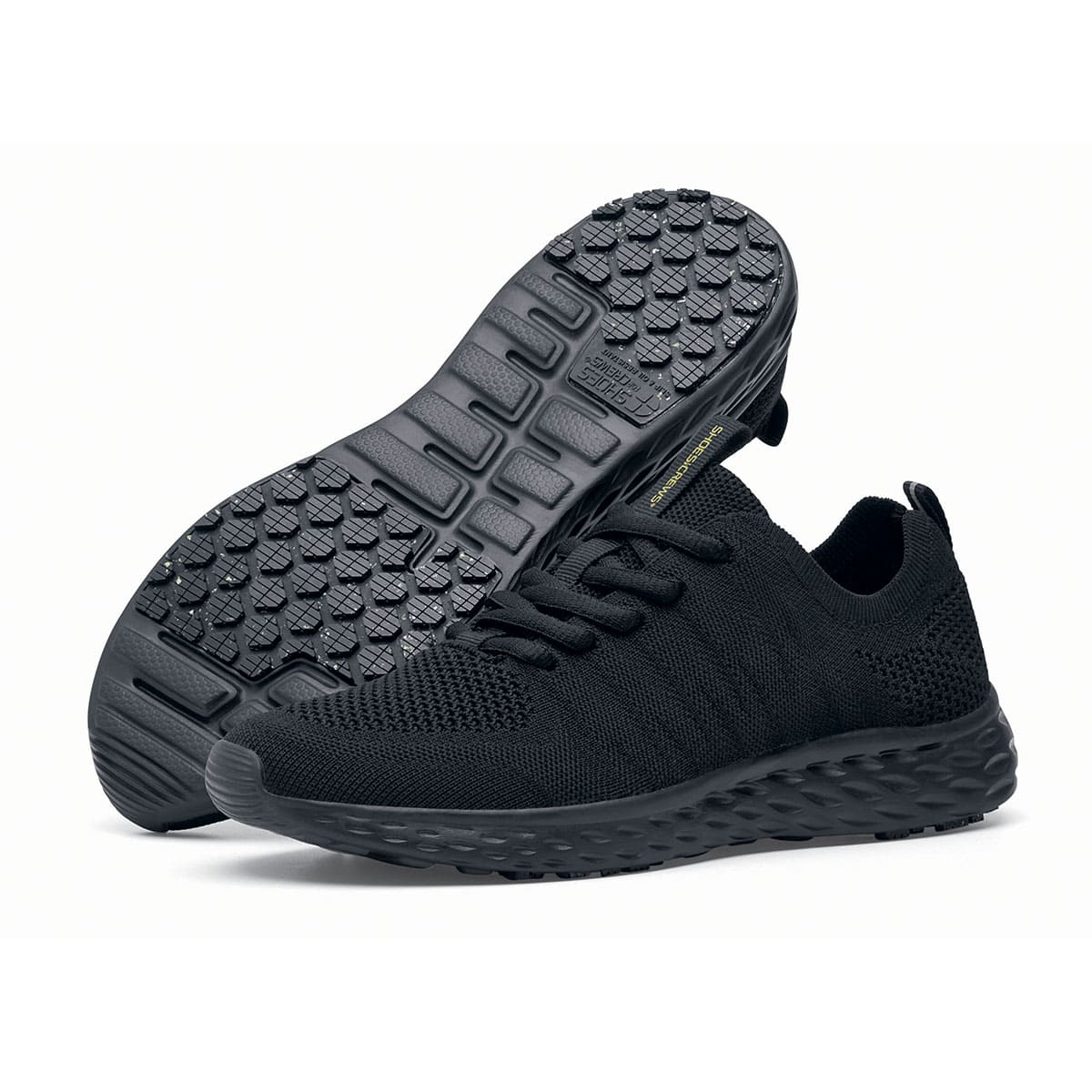 The Everlight™ Everlight Eco Women's Black from Shoes For Crews are lightweight and breathable slip-resistant trainers made from recycled materials,pair seen from the left side and the sole.