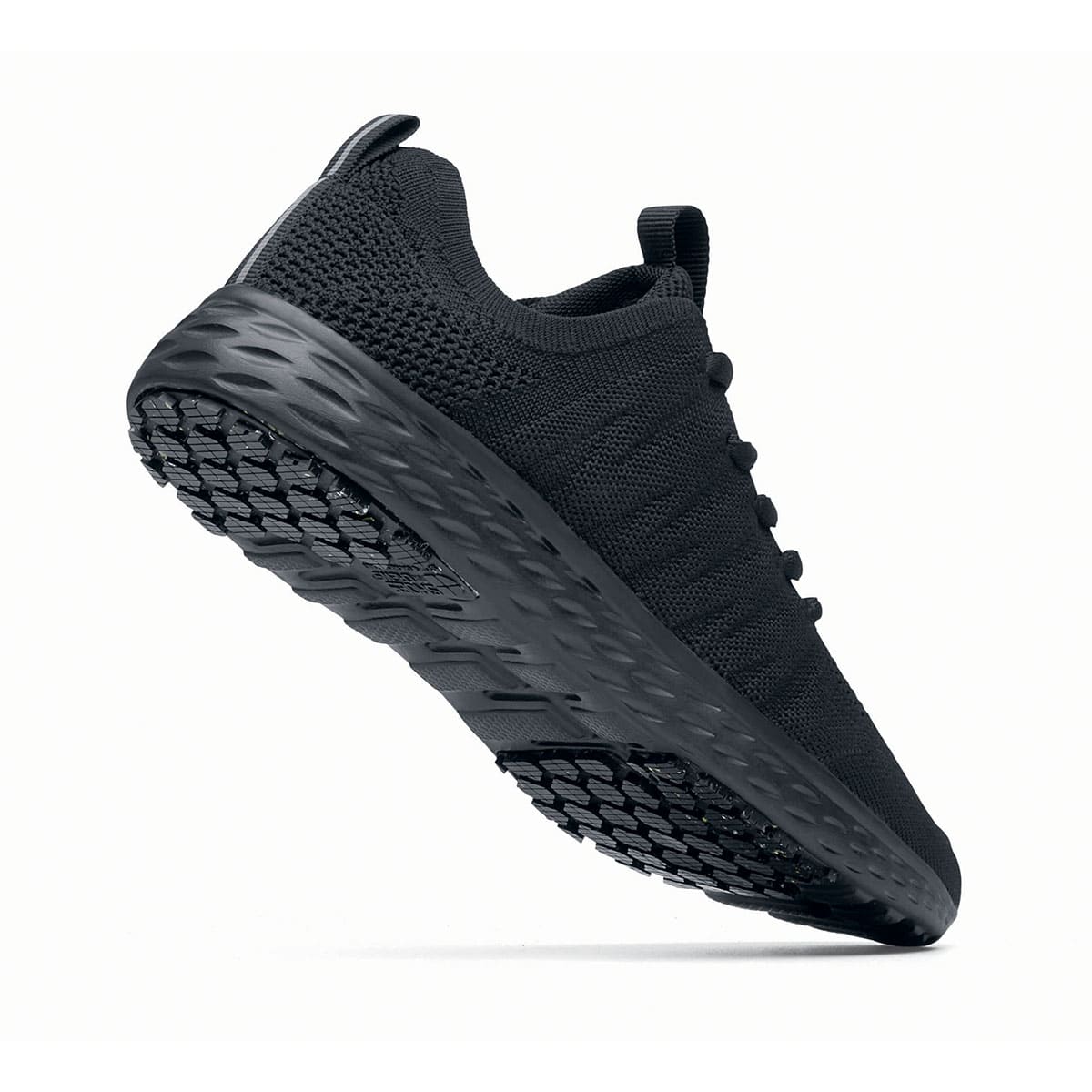 The Everlight™ Everlight Eco Women's Black from Shoes For Crews are lightweight and breathable slip-resistant trainers made from recycled materials, seen from the perpendicular.