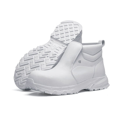 The Inny from Shoes For Crews is a safety shoe with a slip-resistant, clog-resistant upper sole and our advanced TripGuard technology, pair seen from the left side and the sole.