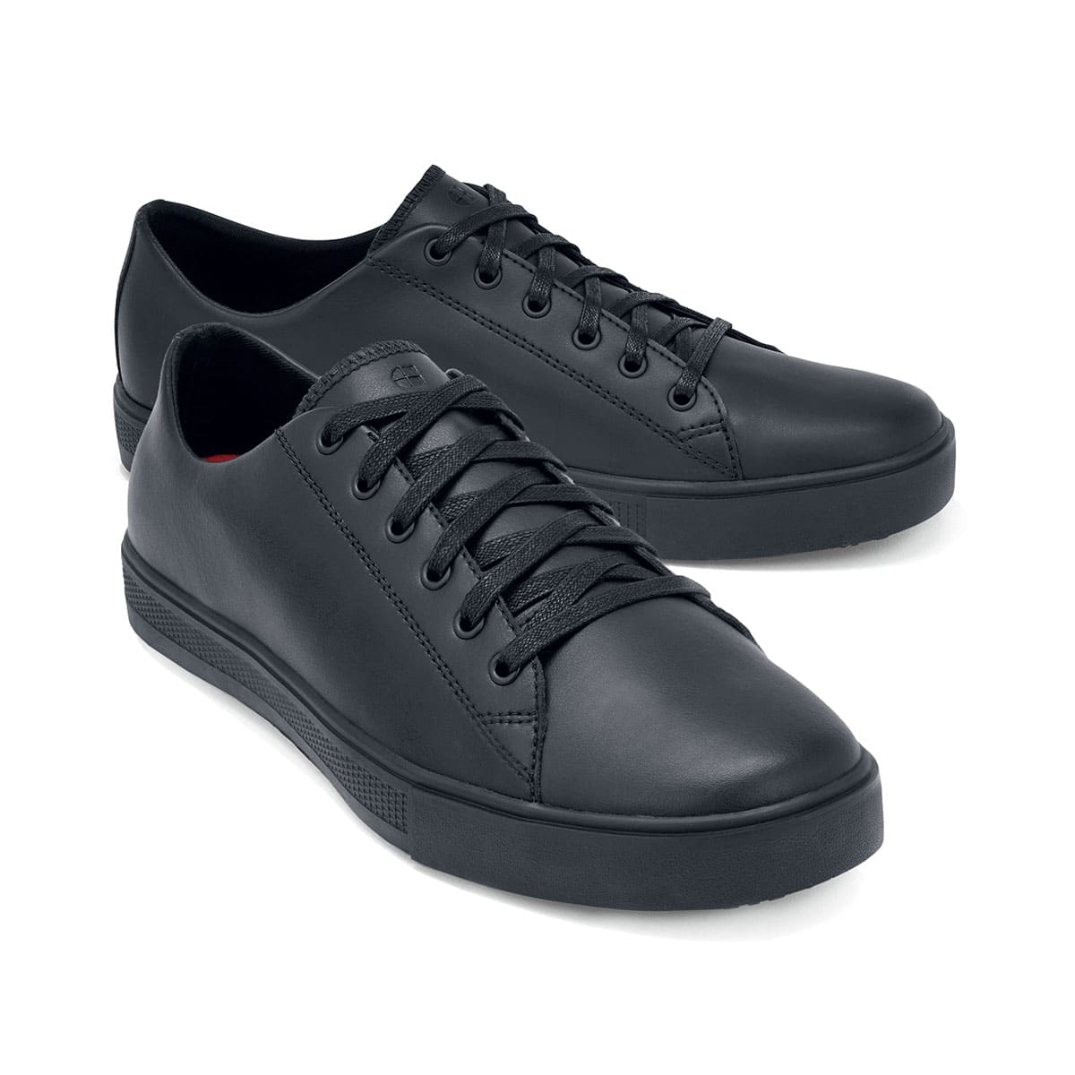 The Old School Low-Rider Black Gladiator Outsole from Shoes For Crews is a slip resistant lace-up shoe designed to provide comfort throughout the day, pair seen from the right side, emphasised on the tip of the right shoe.