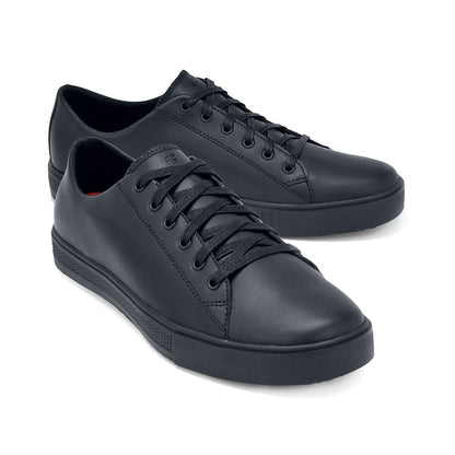 The Old School Low-Rider Black Gladiator Outsole from Shoes For Crews is a slip resistant lace-up shoe designed to provide comfort throughout the day, pair seen from the right side, emphasised on the tip of the right shoe.