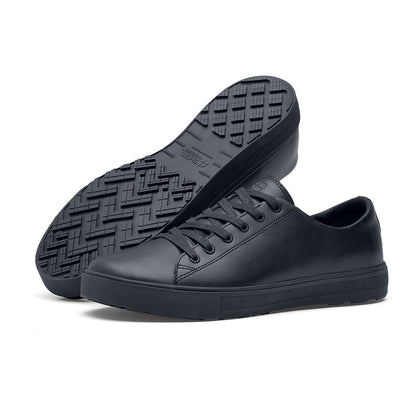 The Old School Low-Rider Black Gladiator Outsole from Shoes For Crews is a slip resistant lace-up shoe designed to provide comfort throughout the day, pair seen from the left side and the sole.
