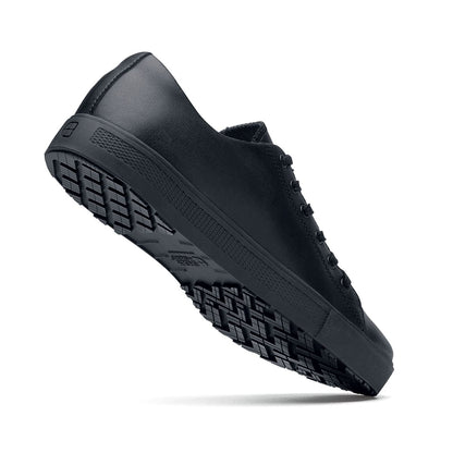 The Old School Low-Rider Black Gladiator Outsole from Shoes For Crews is a slip resistant lace-up shoe designed to provide comfort throughout the day, seen from the perpendicular.
